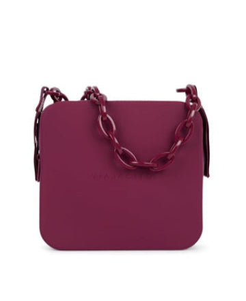 A purple handbag with a chain handle, made from silicone rubber material.